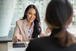 A sales professional using mirroring while discussing with a client